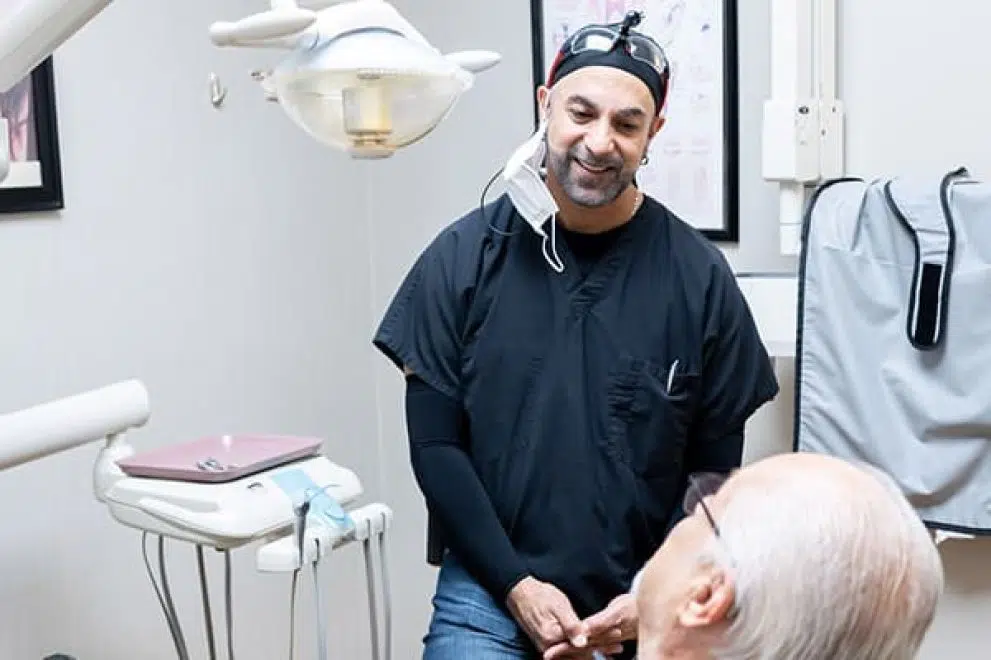 Dr. Amrik Singh speaking to a patient.
